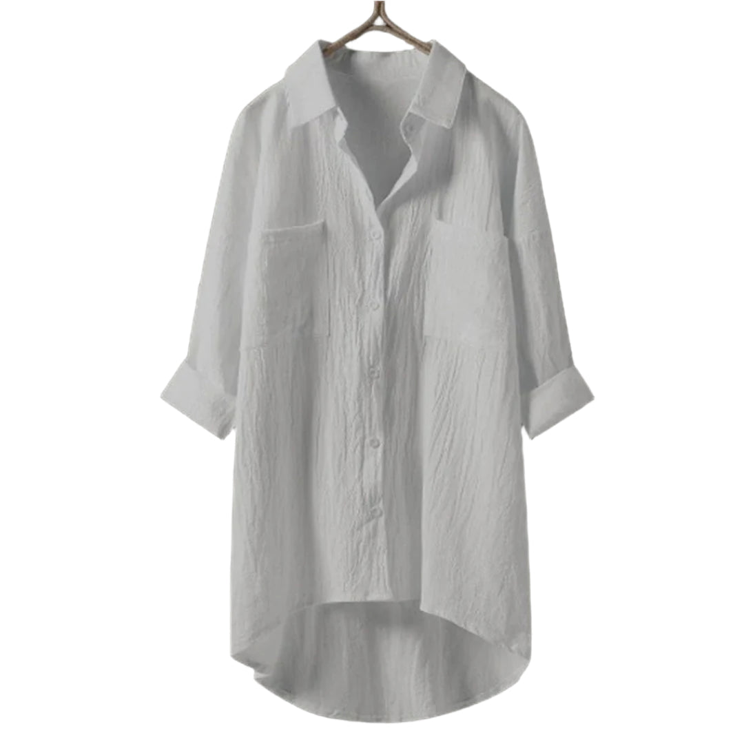 Elegant svart damblus med knapplist och lång ärm, perfekt för kontoret och våren.