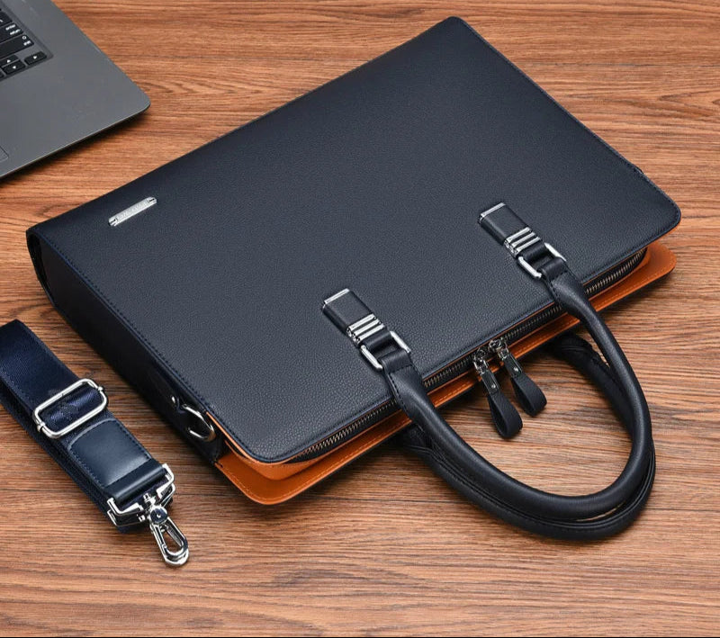 Elegant svart herrväska/portfölj för laptop, skyddande och professionell, idealisk för affärsmän.