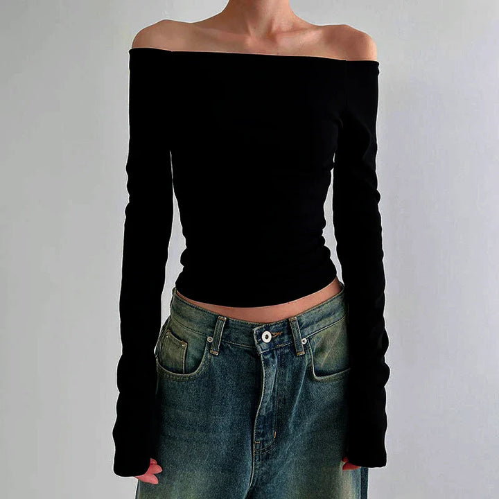 Grön axelbar långärmad damtopp, stilren offshoulder design. Idealisk som festtopp eller vardagstopp.
