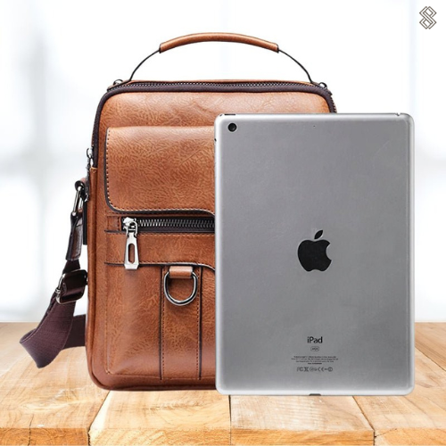 Organiserad damväska med specifika fack för laptop och tillbehör. Elegant och funktionell design.