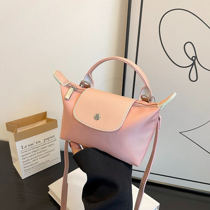 Rosa rymlig damväska, elegant och stilren design. Perfekt mångsidig axelväska.