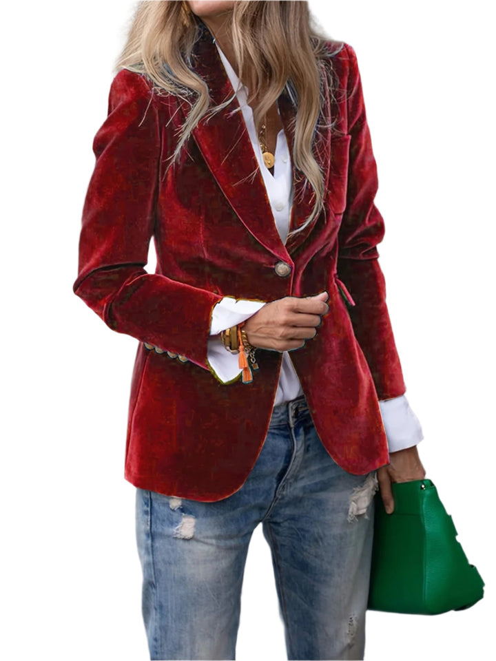 Elegant svart sammetsblazer för dam med glänsande guldknappar, perfekt för fest