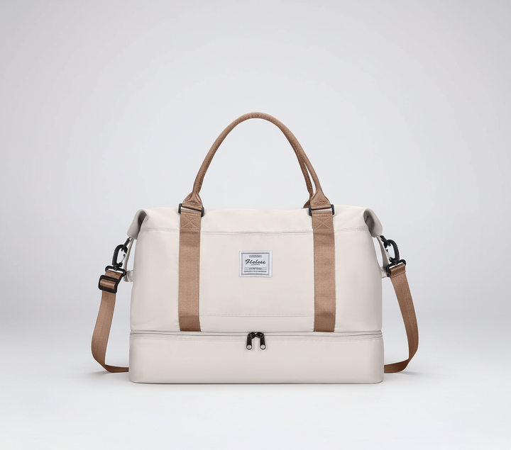 Travelista helgväska i elegant svart design, idealisk för korta resor och träningskläder.