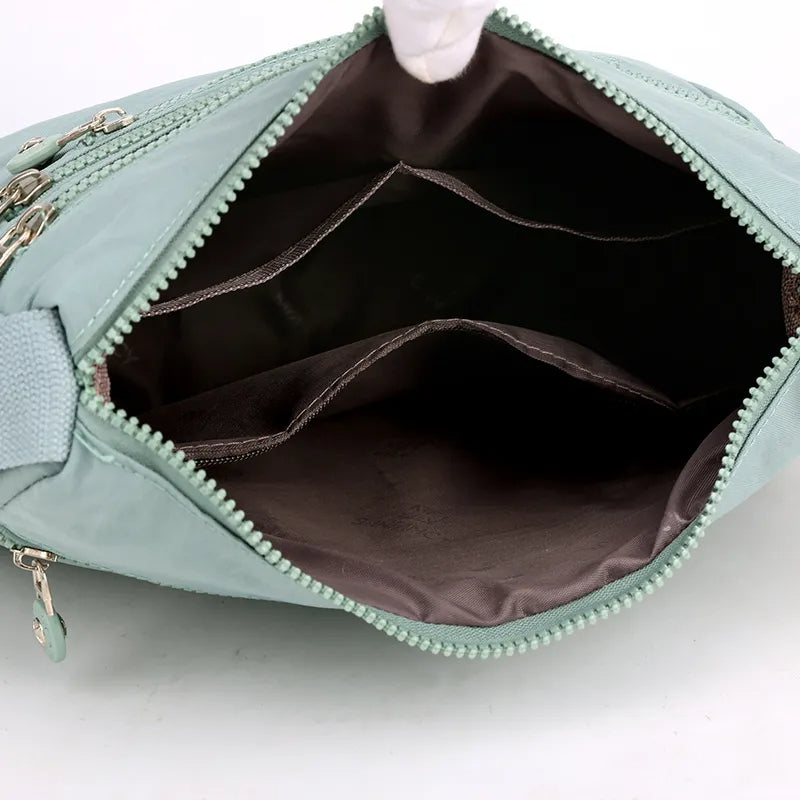 Plommonfärgad vattentät handväska, elegant crossbodyväska. Mångsidig dam messenger väska.