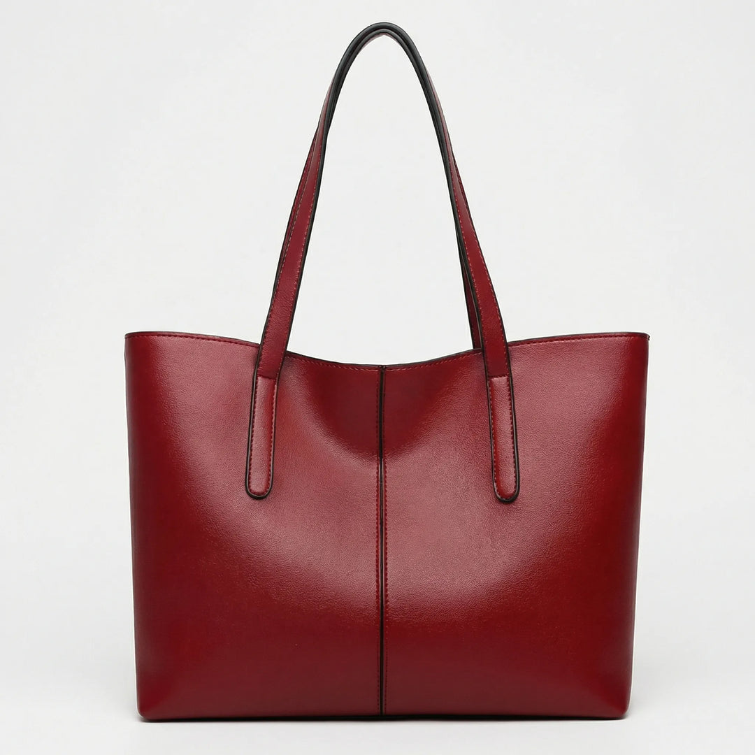Närbild på textur av elegant Jessy toteväska, högkvalitativ damväska perfekt för mode och arbete.