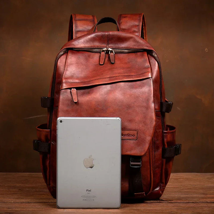 Rymlig bordeaux läderryggsäck för laptop. Idealisk kontorsväska eller elegant resväska, unisex.