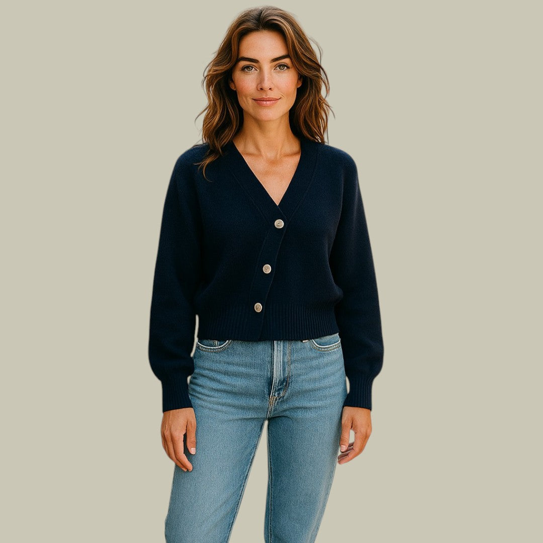 Kvinnors V-ringad tröja med unika korsknappar, perfekt för en elegant och asymmetrisk stil.