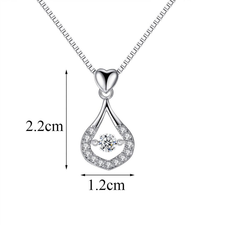 Exklusivt kristallhalsband med vattendroppsdesign. 925 sterling silver smycke för dam, med gnistrande cubic zirconia.