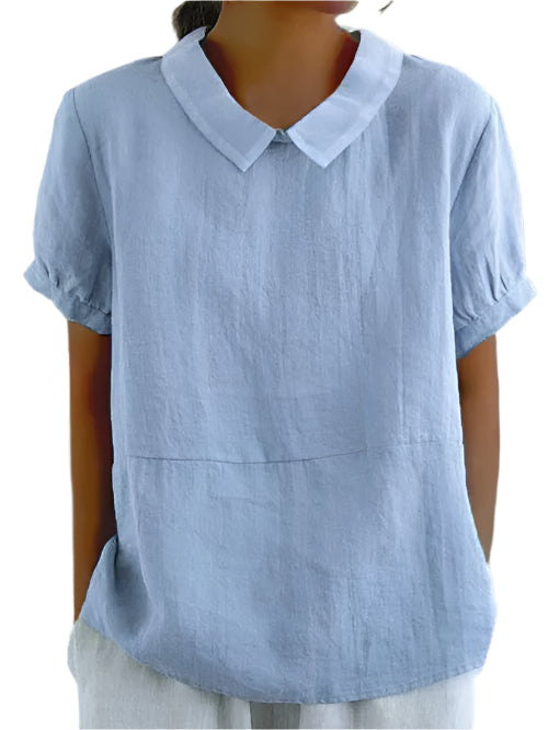 Elegant vit dam kortärmad blus med bubikrage, perfekt som sommarblus.