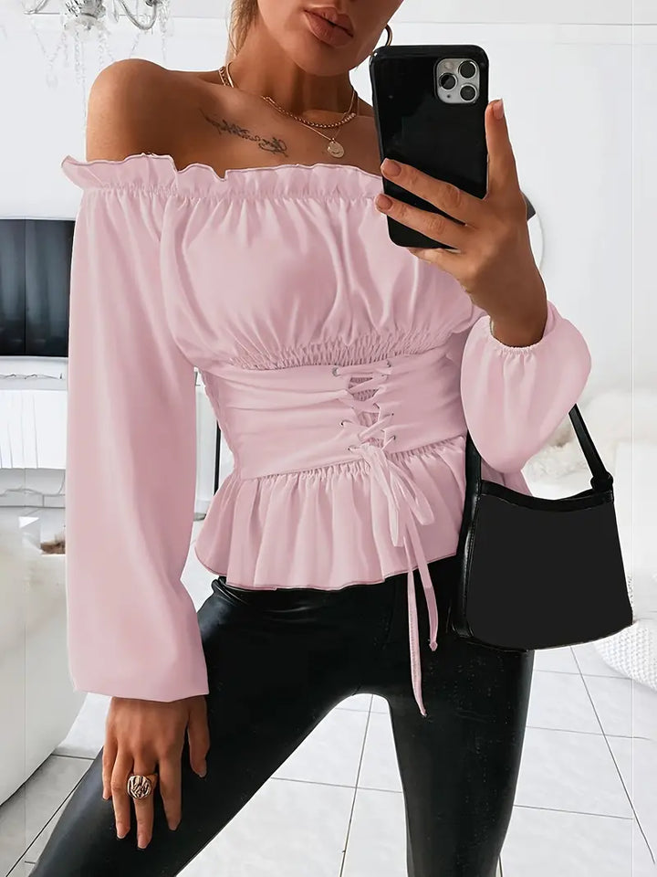 Kvinnors mångsidiga rosa rüschblus med lång ärm, en romantisk och elegant fritidstopp.