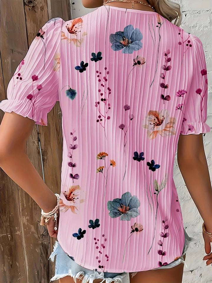 V-ringad damblus i rött, löst sittande och lättviktig, en elegant sommarblus.