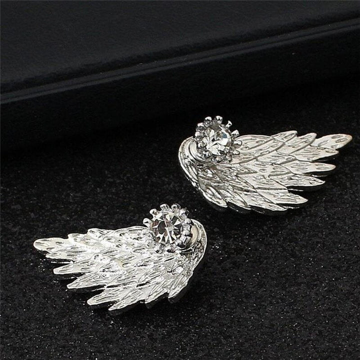 Vackra änglavinge örhängen med zirkonia glitter. Stilrena studs örhängen för kvinnor, eleganta smycken.