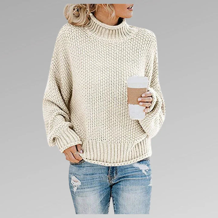 Trendig höghalsad damtröja i stickat, långärmad och mångsidig för en modern look.