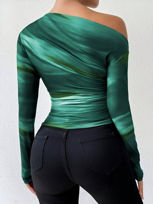 Enkel, enfärgad långärmad t-shirt för dam. Skapar en elegant och bekväm stil för alla tillfällen.