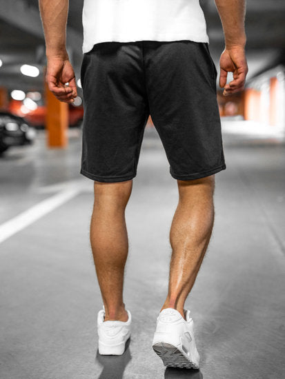 Andningsbara enfärgade shorts för män, idealiska för varmt väder och fritid.