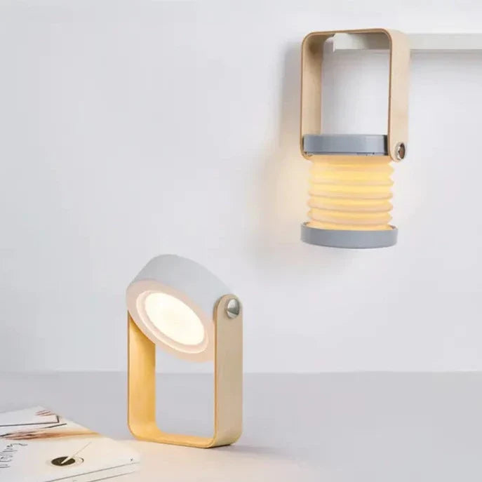 Grå och vit, vattentät fällbar campinglampa med LED för smidig utomhusbelysning.