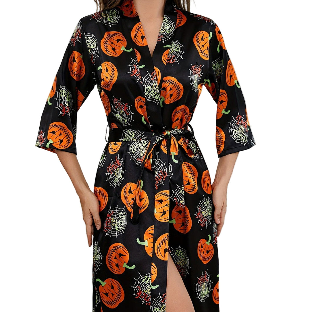 Festlig Halloweenklänning för dam med färgglada pumpamönster. Perfekt temaklänning för höstens firanden.