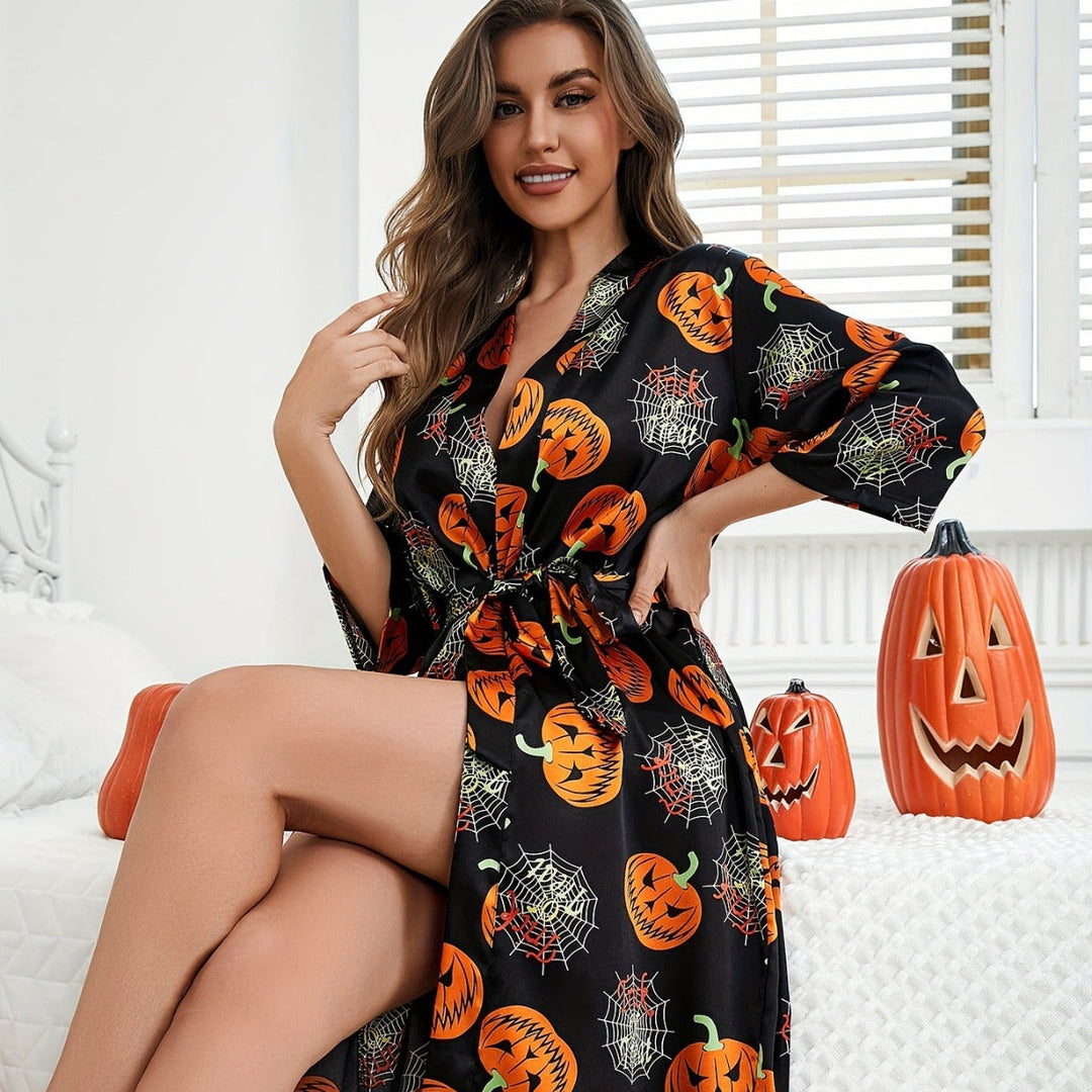 Nära bild av damernas Halloweenklänning, visar det unika pumpamönstret och bekväma tyget. En festlig damklänning.