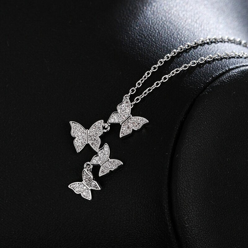 Lyxigt fjärilssmyckesset i sterlingsilver för dam, elegant design med skimrande zirkon.