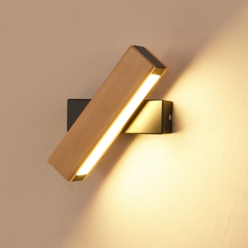 Svart LED-vägglampa i järn, 360° roterbar. Stilren designlampa för moderna rum.