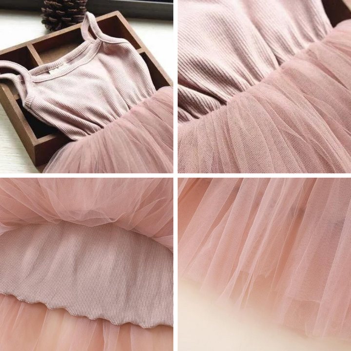 Komplett look av barnens prinsessklänning, ärmlös med paljetter och voluminös tyllkjol.