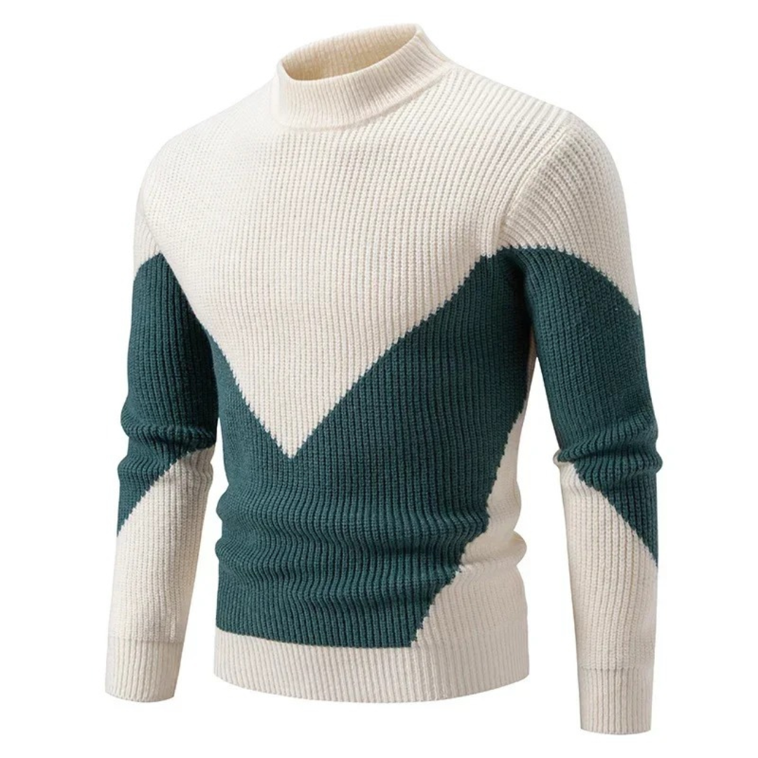 Man bär en stickad herrtröja med geometriskt mönster och hög krage, perfekt för höstens herrmode.