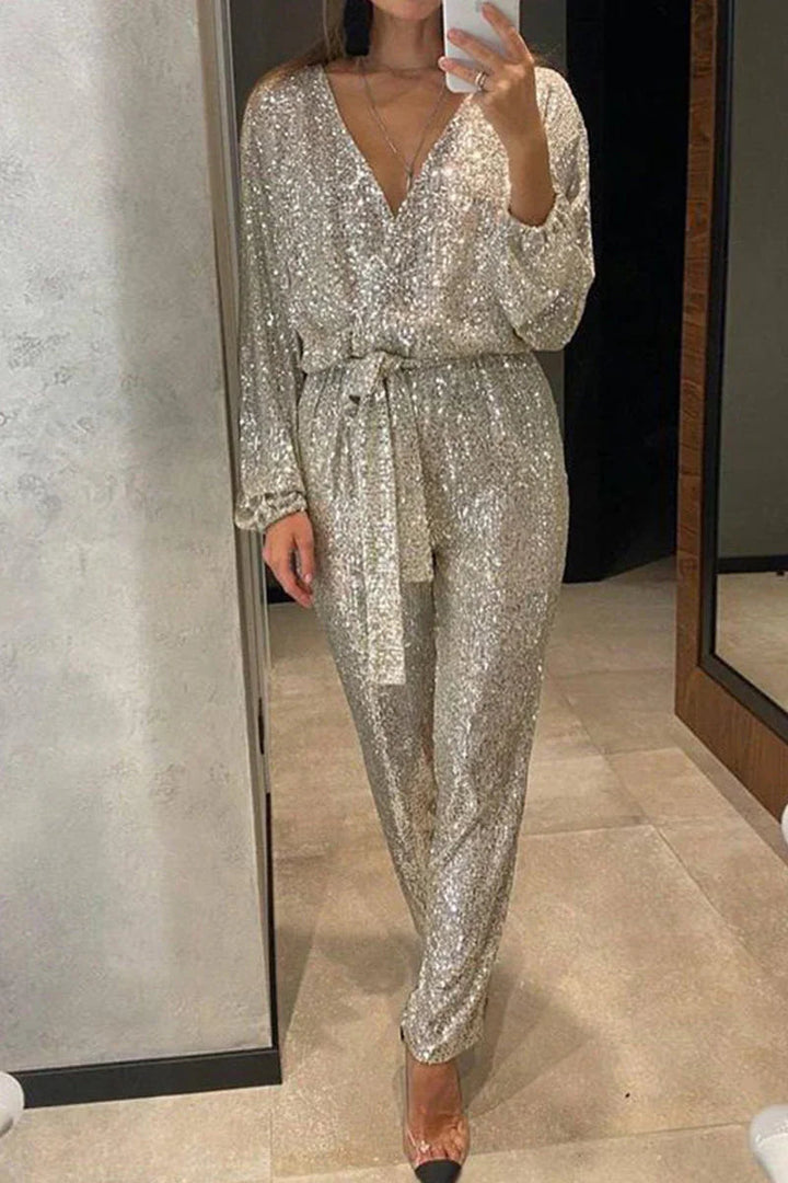 Svart paljettjumpsuit för dam med V-ringning. En glamourös och elegant festbyxdress för speciella tillfällen.