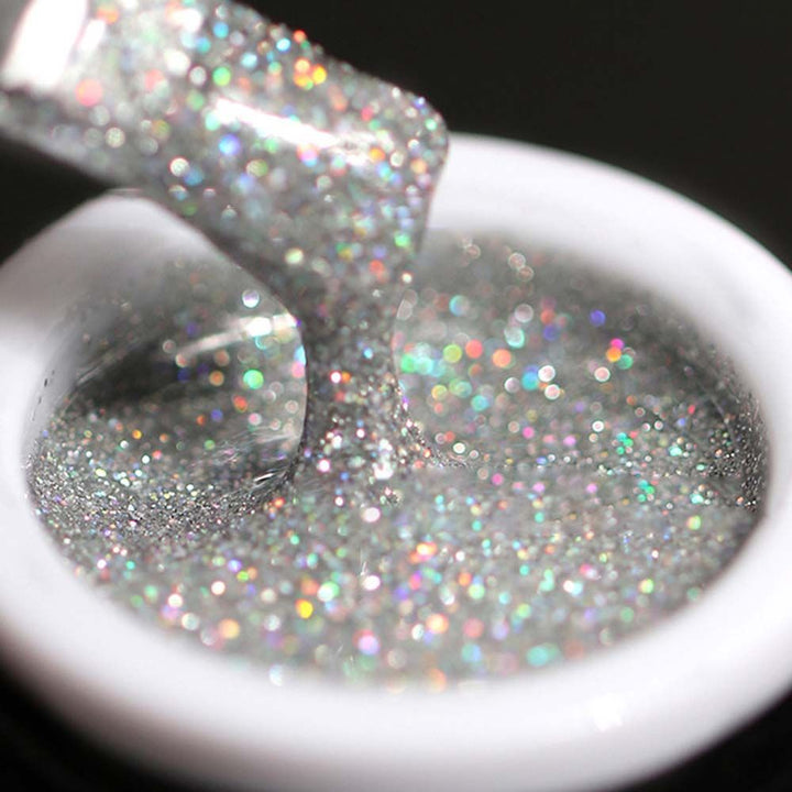 Trendig gelpolish för naglar, fylld med mousserande glitter. Ger en glansig, hållbar manikyr.