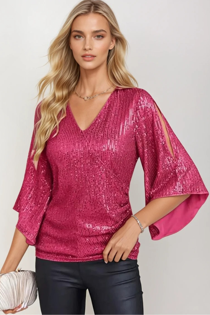Dam långärmad glitterblus som omlottmodell, en sofistikerad festtopp