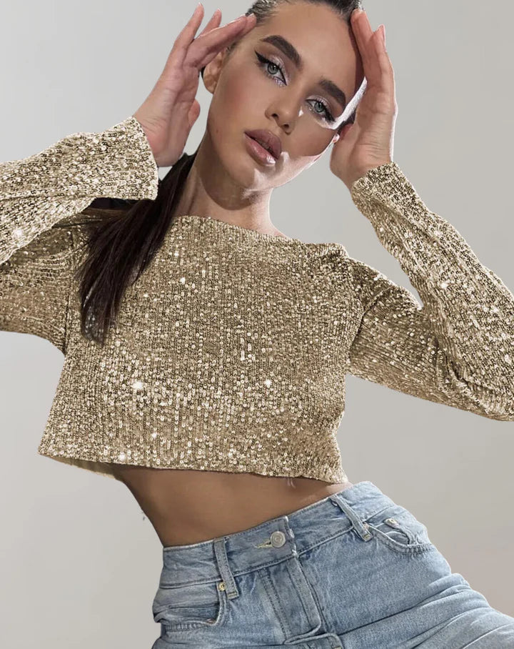 Glittrig crop top för damer, perfekt festtopp med korta ärmar för kvällens glamour.