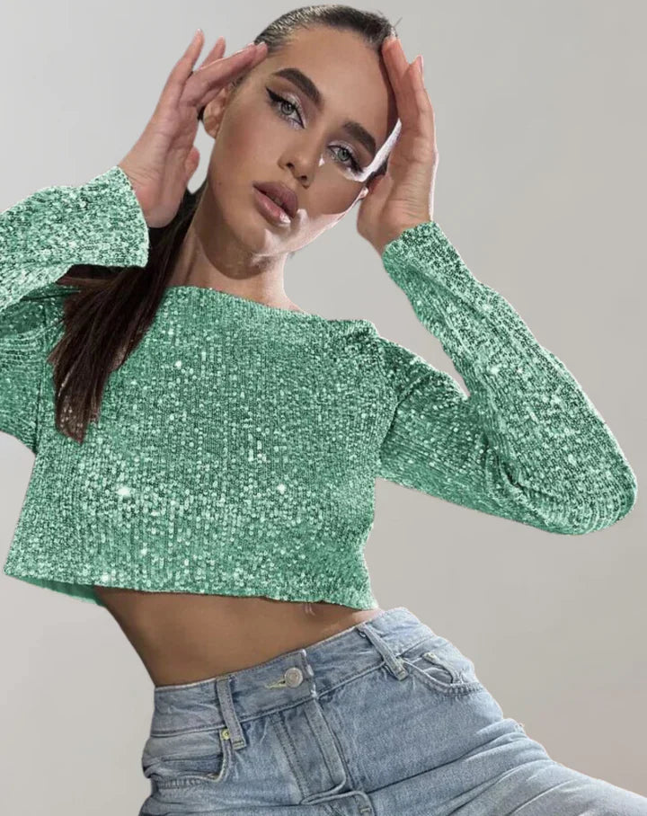 Kortärmad glittrig dam crop top, idealisk festtopp för trendig kvälls- och sommarstil.