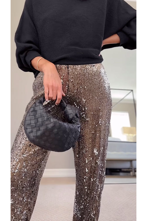 Kvinnors glittriga joggers i brun nyans för en casual men modefylld look.