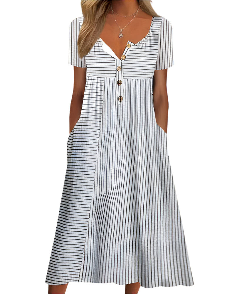 Grå a-linjeformad damklänning med vintage-mönster, V-hals och praktiska fickor. Elegant sommar- & festklänning.