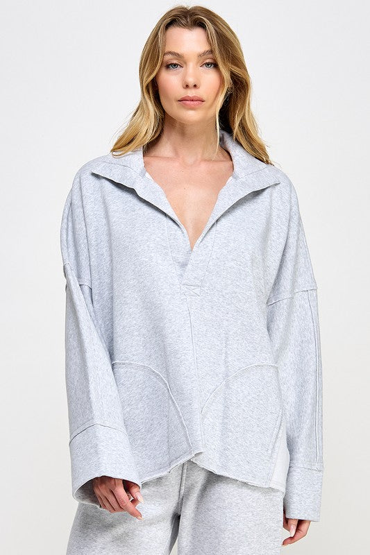 Bekväm grå dolmantröja för damer, perfekt för en avslappnad men stilren vardagslook.