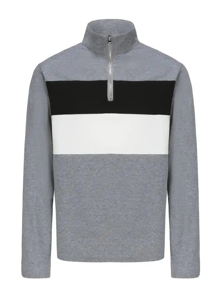 Grå herrtröja i fleece med halvdragkedja, designad som ett bekvämt och värmande lagerplagg för höst/vinter.