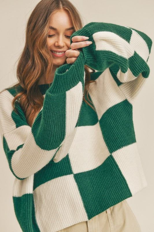 Bekväm avslappnad damtröja med grönt rutigt mönster. Perfekt oversized pullover för stilfulla kvinnor.