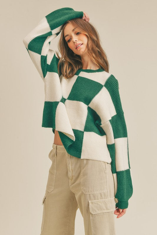 Chic grön rutig oversized pullover för kvinnor. Trendig damtröja idealisk för höstens och vinterns kyliga dagar.