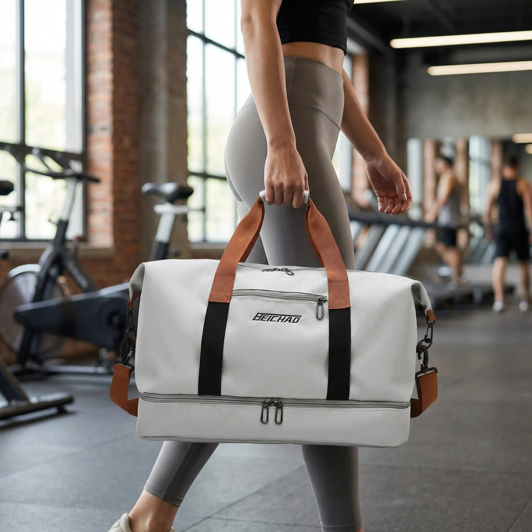 Grå rymlig unisex sportväska Nichole med separat skofack för gym och organiserad träning.
