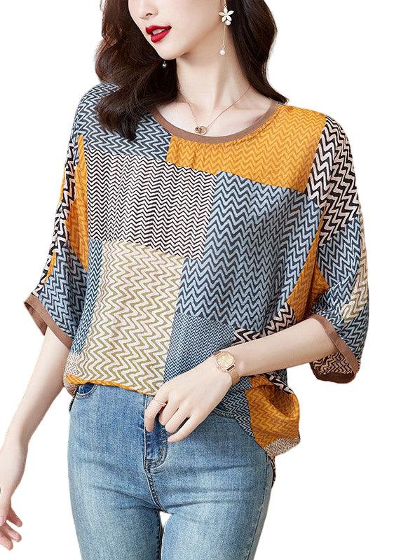 Gul halvärmad topp i patchwork med O-hals, lös passform och sidenliknande tyg, perfekt för sommarstil.