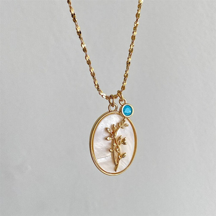 Kvinnors guldpläterade halsband med en tidlös födelsedagsblomma och briljanta zirkoner.