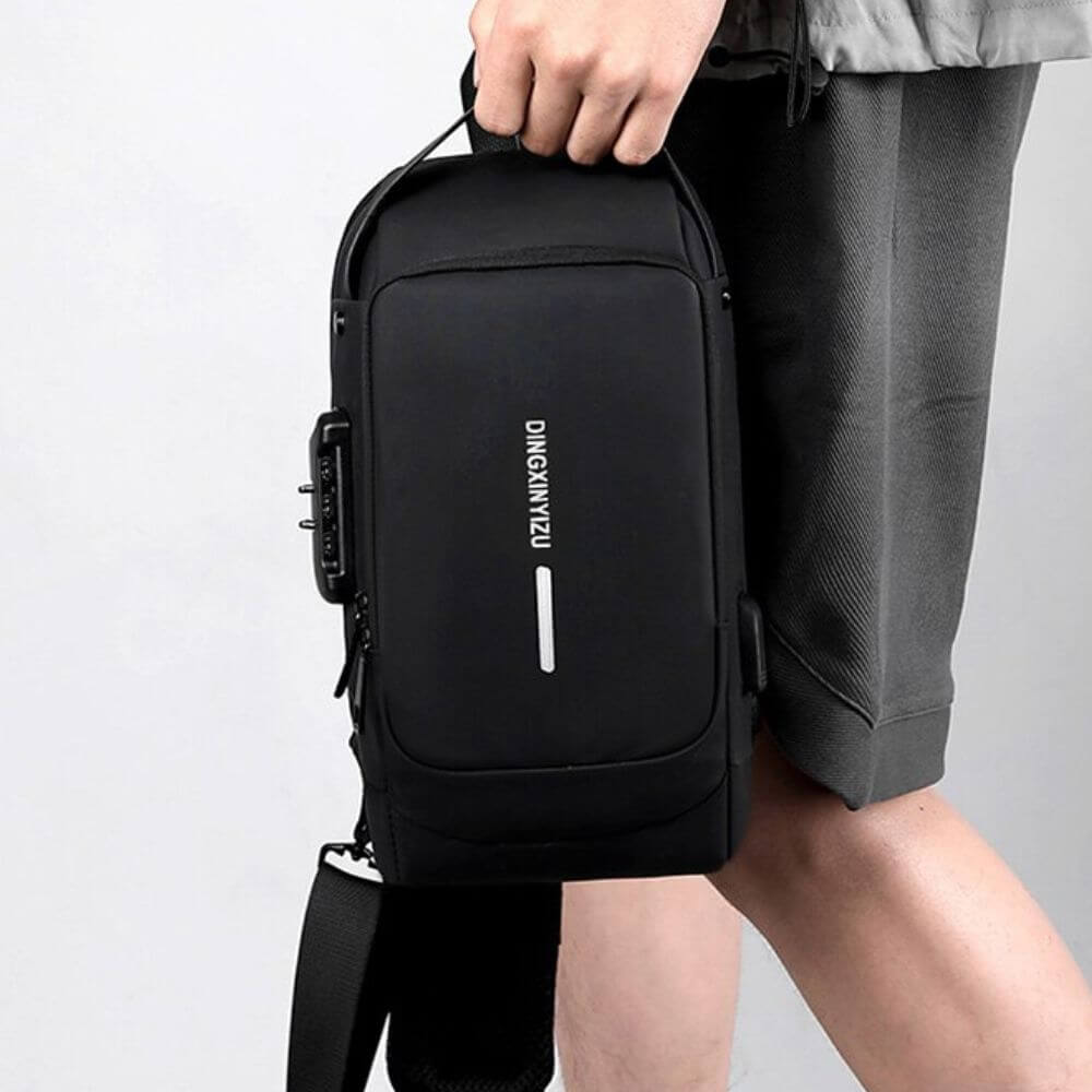 Svart anti-stöld slingväska herrmodell, robust material, med integrerad USB-laddning
