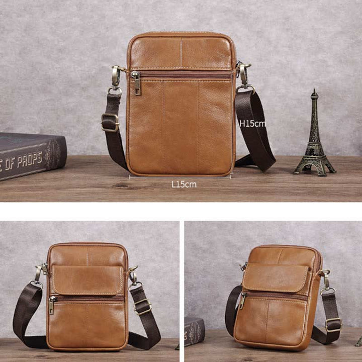 Man bär elegant, tidlös axelväska i läder. Stilren crossbody-väska som komplementerar outfiten.