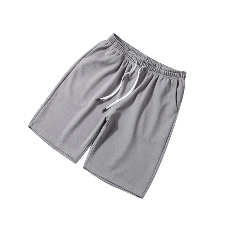 Detaljbild av herrshorts midjeband, betonar flexibilitet och passform. Bekväma gymkläder.