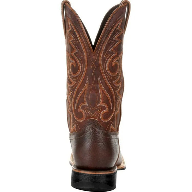 Bakifrån bild av herr cowboystövlar som visar skons robusta häl och PU-lädermaterial.