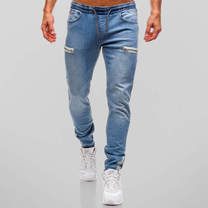 Herr joggingbyxor i modern stil med dekorativa blixtlås. Perfekt för sport och fritid, bekväma.