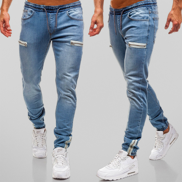 Stilrena herr joggingbyxor med hög midja och dekorativa blixtlås. Idealiska för en avslappnad men modern look.