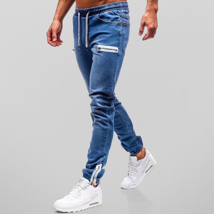 Herrjoggers med trendig design och dekorativa blixtlås. Sköna och moderna byxor för den stilmedvetne mannen.