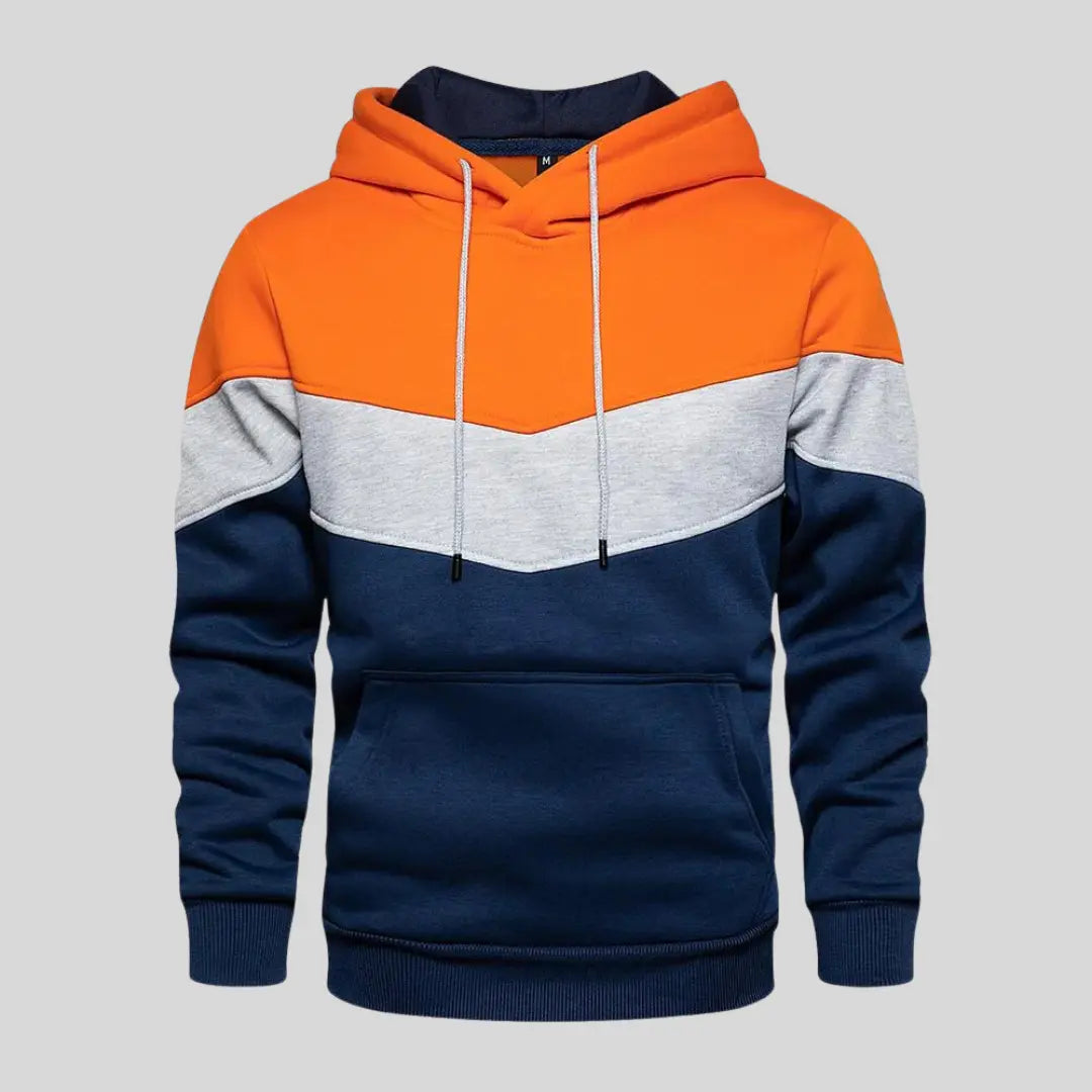 Man visar upp sin unika stil med en herr patchworktröja. Trendig design och avslappnad passform, perfekt för vardag.