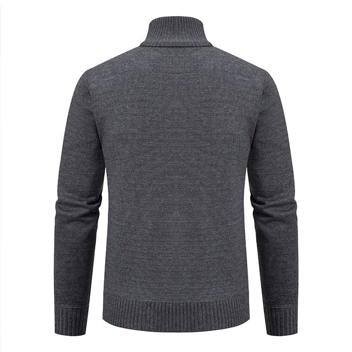 Detalj av mönster på stickad herrtröja, polyester och elegant design