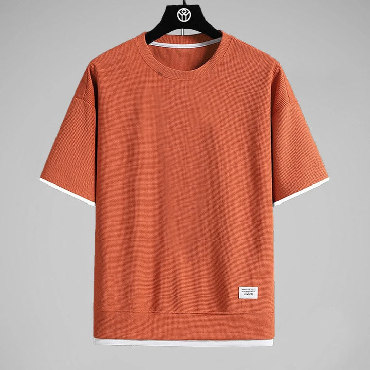 Minimalistisk herr våffel T-shirt, ren design med komfortabel passform för stilren vardag.